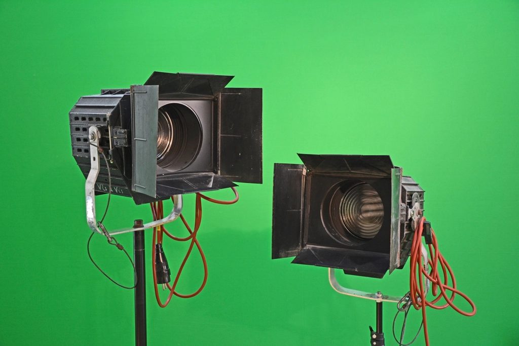 Two fresnel lamps on stands, barn doors open